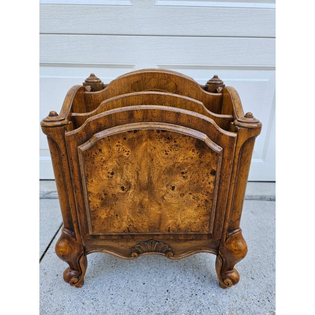 This canterbury or magazine rack by Weiman has a burlwood veneer front panel and sits atop cute cabriole-like feet. The...