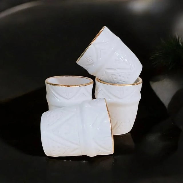 A set of 4 handmade ceramic cups with Berber design and bright colors painted by a Moroccan craftsman from Marrakech. The...