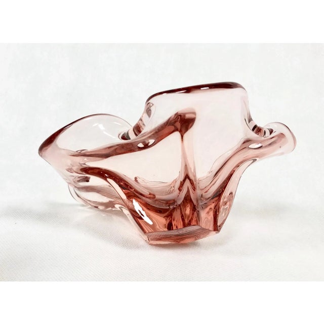 The item is made of soda-blasted glass, colored in the mass, hand-formed into an organic pattern. The condition of the...