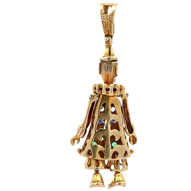 Vintage 10K yellow gold clown pendant featuring multi-color gemstone inlay on the front. The head, hands, and feet are...