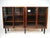 An exceptionally crafted black walnut bookcase with four wood framed glass doors having piano hinges showing the great...