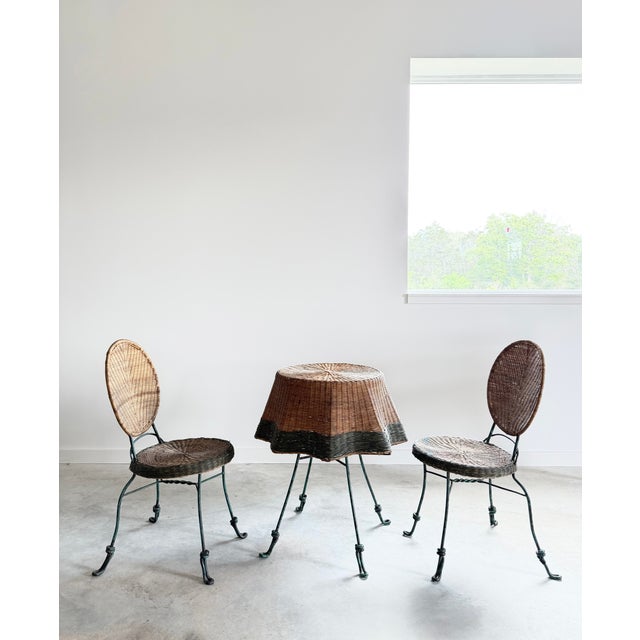 This vintage patio set features a faux "draped" wicker table and two matching chairs. The pieces are constructed with...