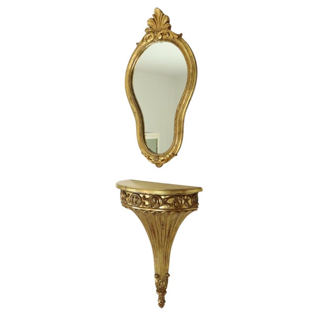 Beautiful crested mirror with console, gilded with gold leaf, entirely in the classic Baroque style, circa mid-20th...