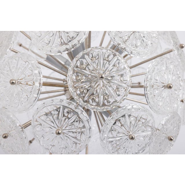 An exceptional mid-century sputnik chandelier featuring beautifully shaped floral glass elements set against a polished...