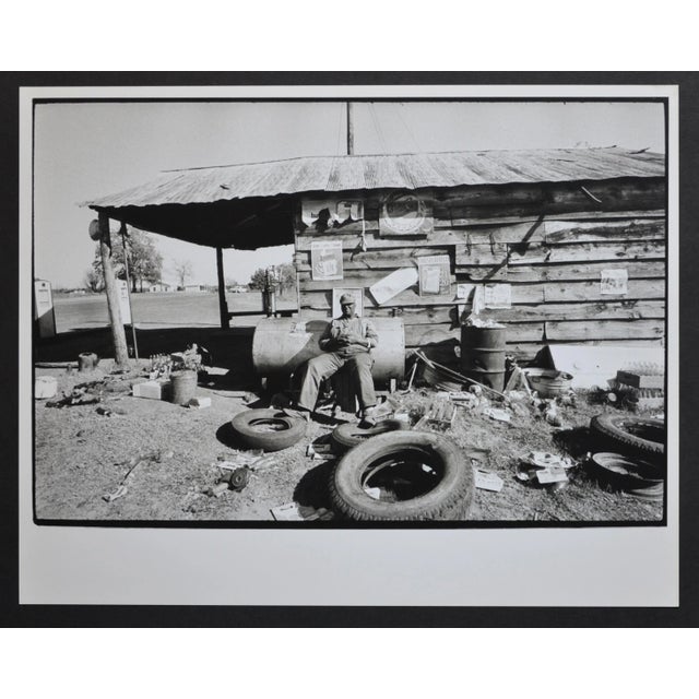 Mississippi Area Man Sitting in Front of His Hut by Rolf Gillhausen, US, 1960s For Sale