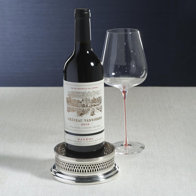 Add a touch of sophistication to your wine service with the Sommelier's Edge Wine Bottle Coaster. Featuring a round...