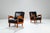 This striking pair of vintage lounge chairs showcase quiet strength and refined craftsmanship. Expertly constructed from...
