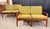 This matched pair of teak loveseats by Arne Wahl Iversen for Komfort of Denmark are a classic expression of Scandinavian...