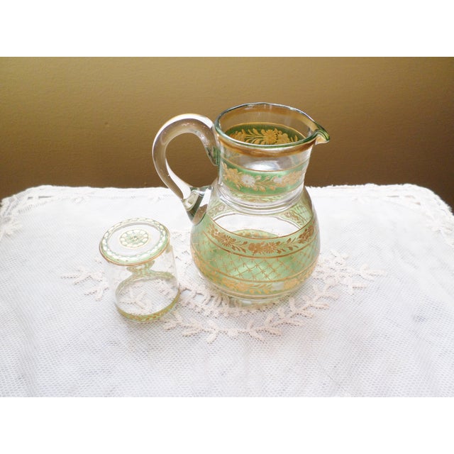This is a Gorgeous! Vintage Czechoslovakia Green & Gold Etched Glass Water Carafe With Cup with a Lovely Etched Design in...