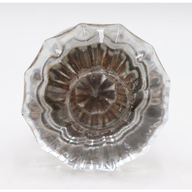 Antique fluted clear glass door knob paired with a brass rosette. The original rosette mounting screws are not available....