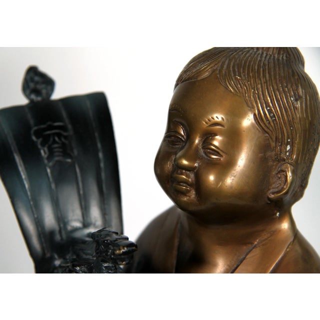 Beautiful vintage c.1980's cast brass Chinese child holding a verdigris bronze toned toy ship! This is a very whimsical...