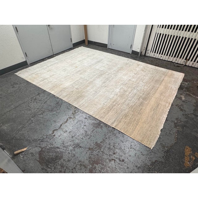 Design Plus Gallery presents an 8ft 12in × 12ft 1in Stark Bendi Collection Jacquard Rug. The two-tone Wilton rug is...