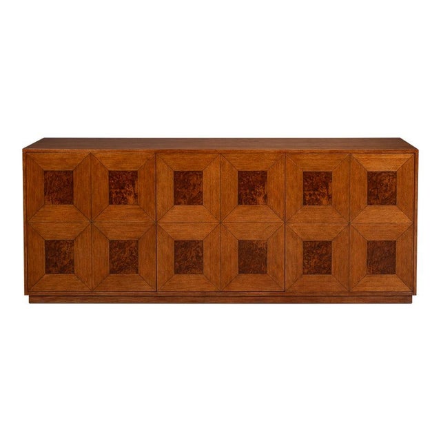 Geometric woodwork supplies the decoration across an 86-inch cabinet front. The front reads as four cabinet doors divided...