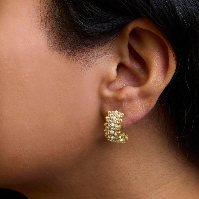 Emanating exquisite elegance, these J Hoop earrings are meticulously crafted from .925 sterling silver with a lustrous...
