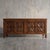 Bold, deeply carved geometric starburst motifs give this substantial four-door credenza an undeniable architectural...