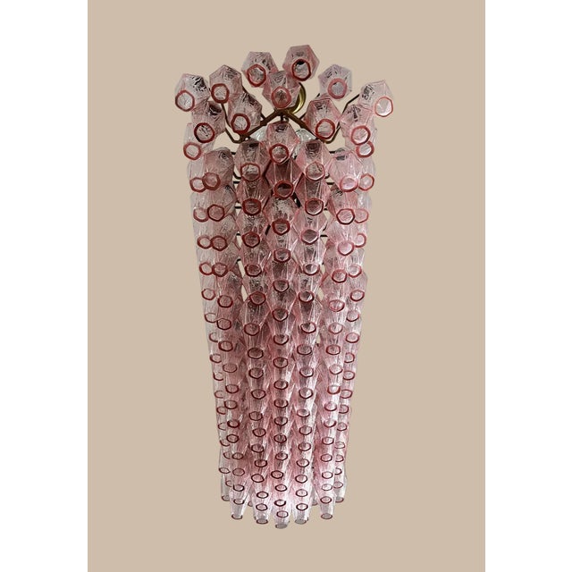 DUTIES FREE An extraordinary Italian chandelier composed of 138 refined Murano glass “poliedri” in a delicate pink tone,...