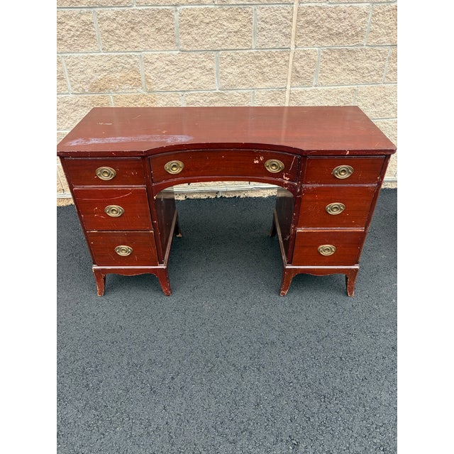 A handsome vintage seven-drawer pedestal writing desk manufactured by American Furniture Co. of Martinsville, Virginia,...