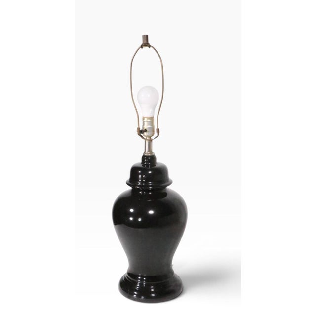 Chic black ginger jar form table lamp in excellent, original, clean and working condition. Circa 1970's, shade not...