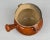 A 19th century French glazed terracotta Toupin pot with distressed, speckled terracotta glaze and yellow glazed interior....