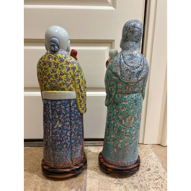 Two Chinese Famille Rose Sanxing dieties in enameled and glazed porcelain. Each statue sits on a custom made base. Fu...