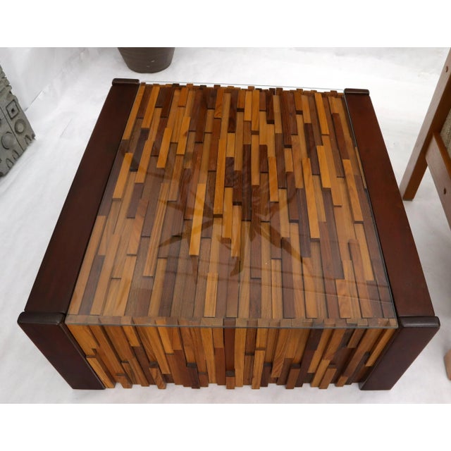 Pair of Percival Lafer coffee tables with glass tops over rosewood hardwood mosaic.