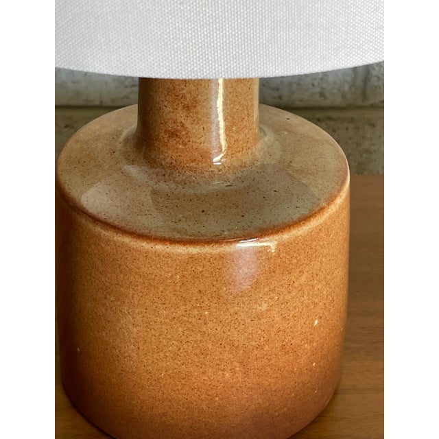 Table lamp designed by ceramicist duo Jane and Gordon Martz for Marshall Studios. Color is an unusual terra-cotta like...