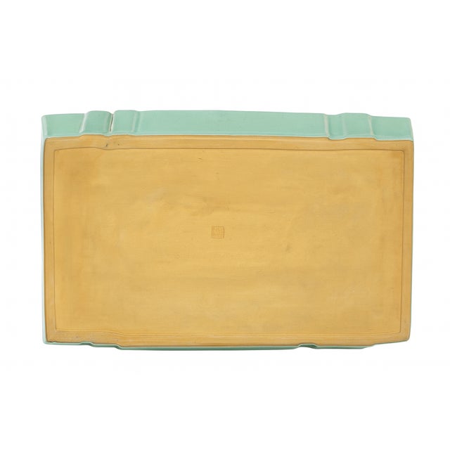 Elegant large rectangular pottery tray or low bowl finished in a luminous aqua-celadon glaze, bearing a crisp impressed...