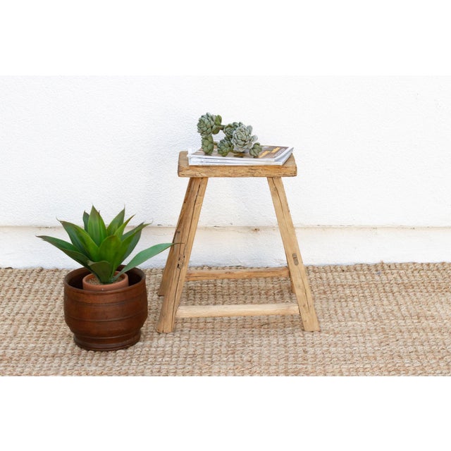 Full of age and character, this farmhouse style joint stool has a weathered look. This antique Asian stool has a stretcher...