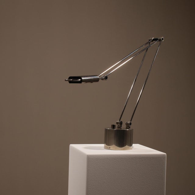 The ‚Stella‘ table lamp is a masterpiece of geometric precision. Designed by Wolfgang H. Kanbach, it features a delicate...