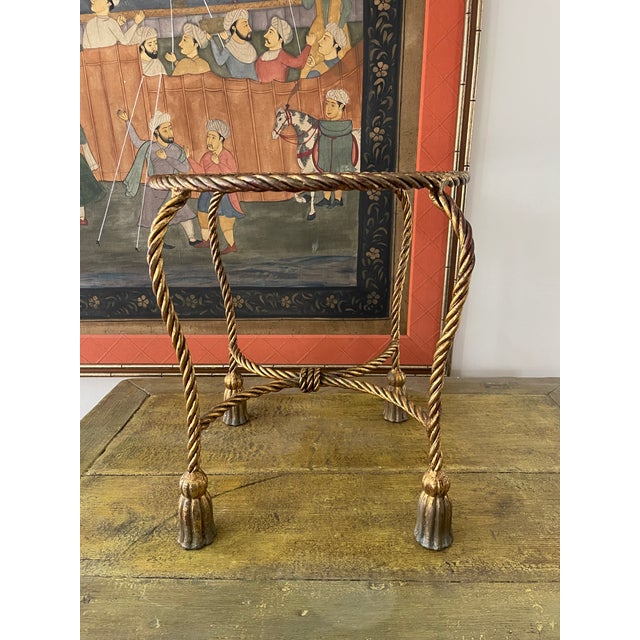 Fabulous vintage Italian rope stand or side table. The table is made of metal that has been painted and a guilt gold....
