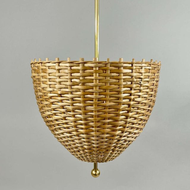 This mid-century pendant was designed and manufactured in Sweden in the 1950s to 1960s. The light features a sculptural...