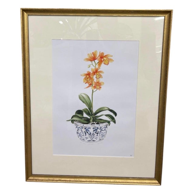 Bring timeless elegance to your space with this vintage framed botanical print featuring a vibrant orange orchid in full...