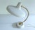 Mid Century 1950s lamp, white metal base and shade, brass stem mounted on a podium base, mushrooom shade Dimentions: 23 cm...