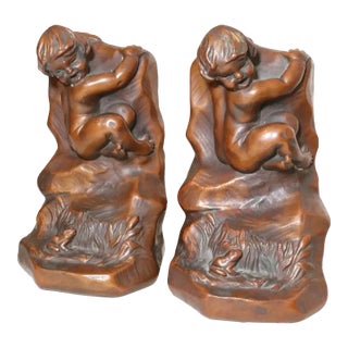 Large Pair of Antique Armor Patinated Bronze Clad Co. Nude Cherub Frog Bookends For Sale