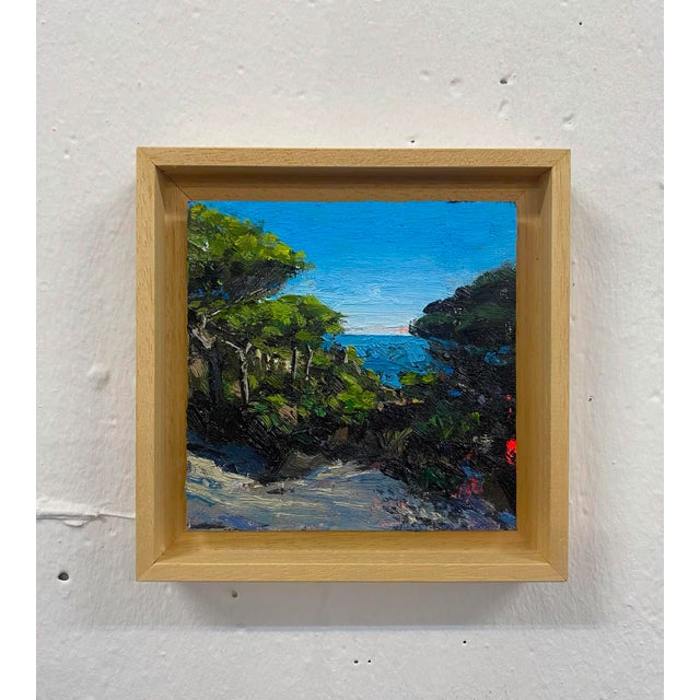 This artwork depicts a serene view of Matalascañas Beach, framed by lush greenery that leads the eye to the shimmering...