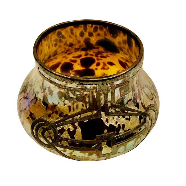 A piece of art glass with silver overlay onto the glass by Czech Republic maker, Loetz. It’s about 1910 can’t find a...