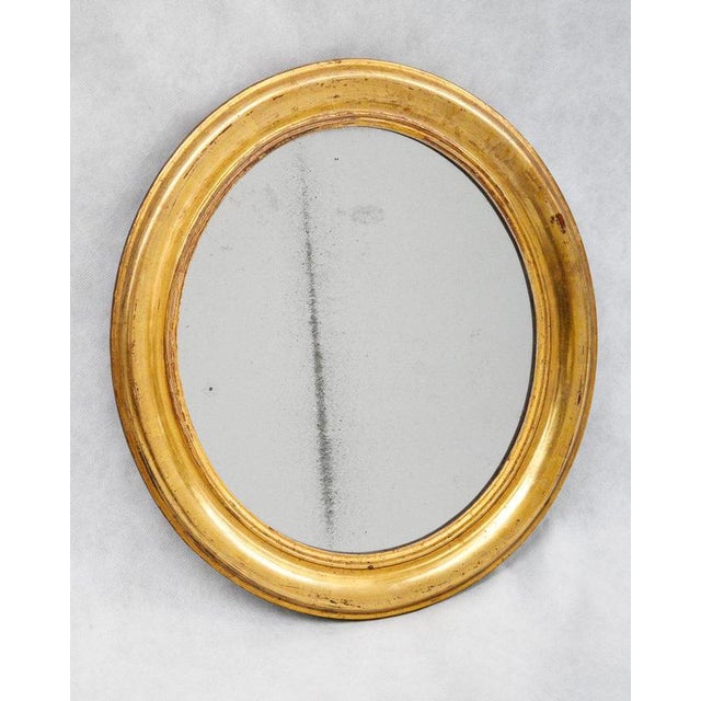 Meet this petite french oval mirror charmer. This sweet foxed beauty is perfectly proportioned for all those “awkward-but-...