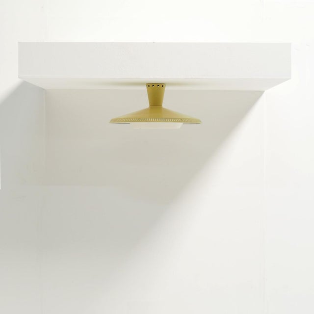 This philips nb 92 flush mount quietly brings the spirit of the 1950s into your home. that era’s renewed sense of freedom...