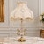Elegant vintage French-style table lamp featuring a beautifully cut crystal body accented with ornate gold leaf metalwork...