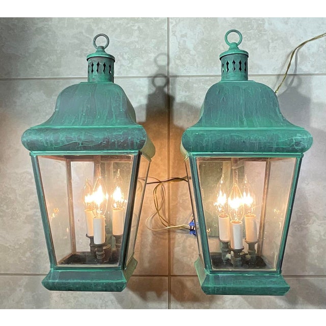 add a timeless historical touch to your entryway with this spectacular matching pair of solid brass outdoor wall lanterns....
