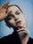 The artwork presents a striking portrait of a young woman, her serene expression and delicate features captured with...