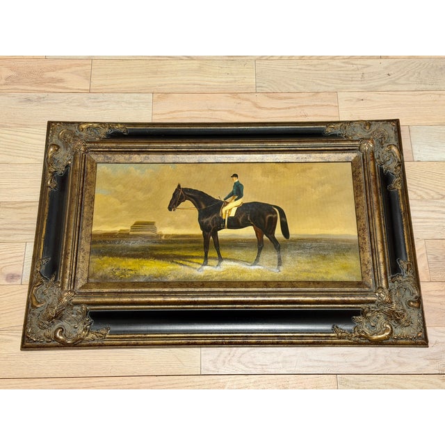 A striking matching pair of traditional equestrian sporting paintings, each depicting a thoroughbred racehorse with jockey...