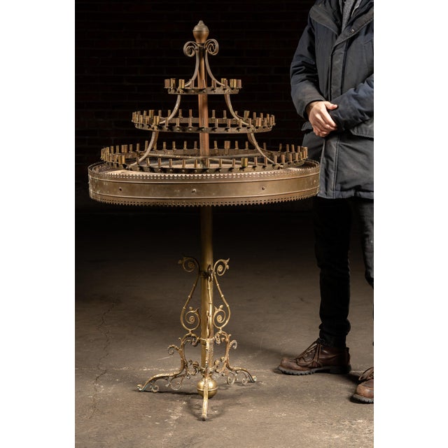 Striking large-scale brass candelabrum table composed from two distinct antique elements married together by our in-shop...
