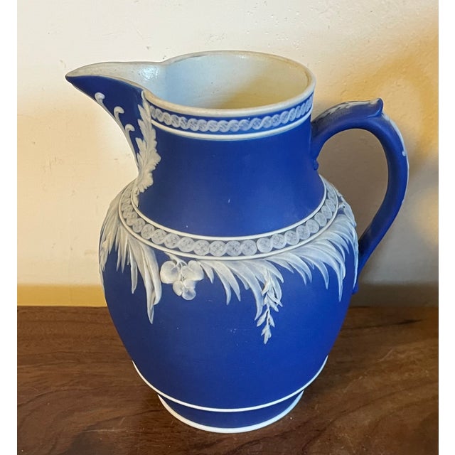 Antique 19th century Wedgwood dark blue jasperware pitcher circa 1863. Nice size for water at the bar or table or for use...
