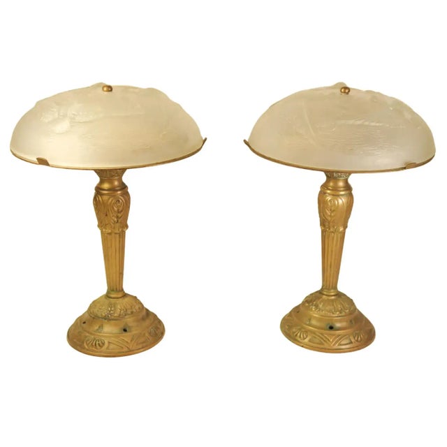 A pair of french art deco highly decorative brass & glass table lamps in the manner of léon hugue and rene lalique léon...