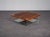 A refined ponton coffee table designed by osko + deichmann for ligne roset in 2006. The design combines a warm walnut...