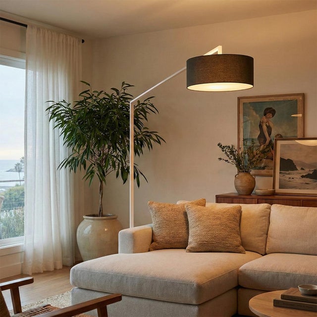 The Stretch Arc Floor Lamp is a modern lighting solution designed by Kirby Groce in 2011. This lamp features a striking...
