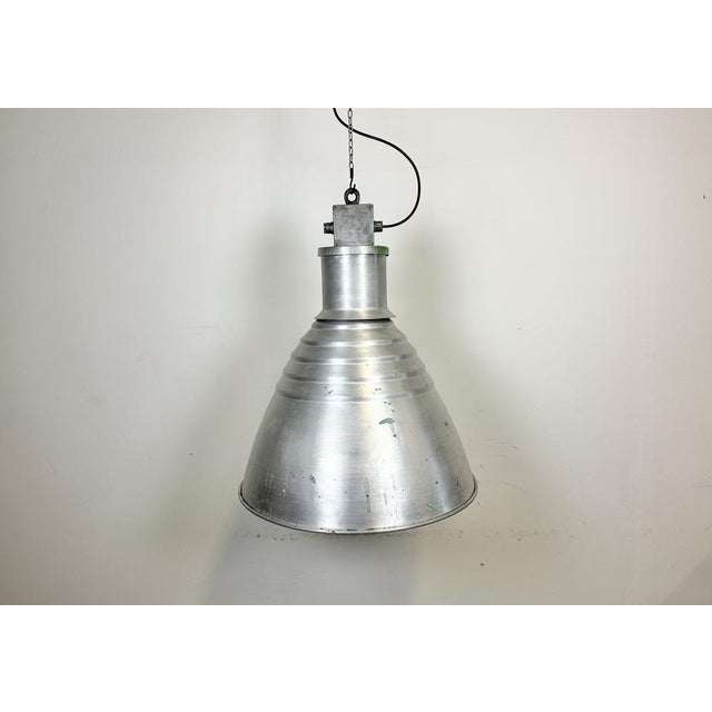 This pendant lamp was made by Elektrosvit and originally used in a factories in former Czechoslovakia in the 1960s. The...