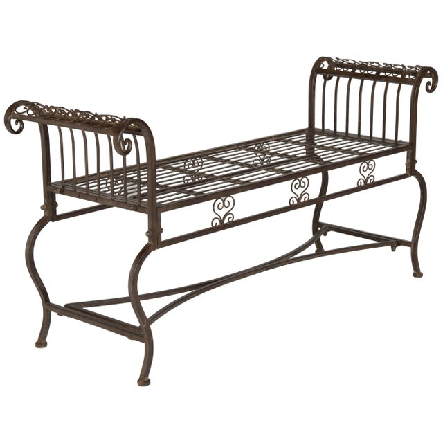 Inspired by the intricate detailing on Victorian homes, the fanciful ironwork on this rustic brown outdoor bench is so...