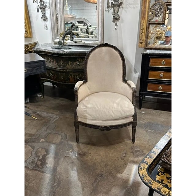 18th century French Louis XVI carved oak bergere. Circa 1780. Perfect for today's transitional designs!